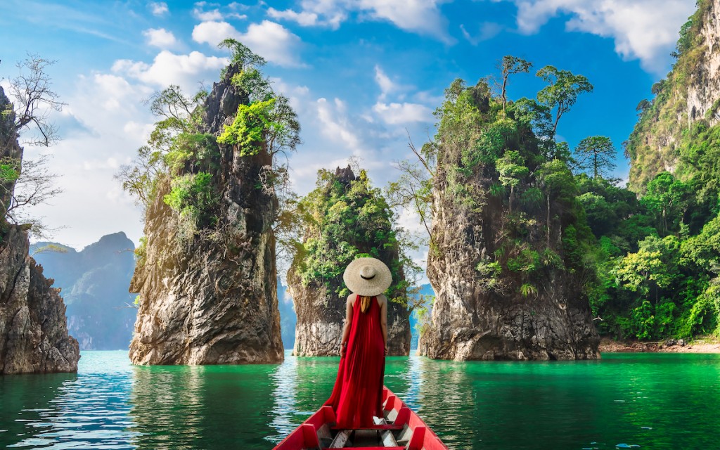 Woman traveler on boat joy nature view rock island scenic landscape Khao Sok National Park, Famous attraction adventure place travel Thailand, Tourism beautiful destinations Asia holiday vacation trip