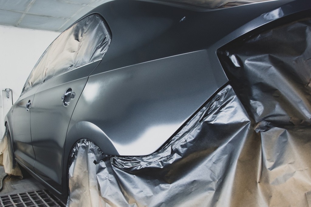 Car at the stage of painting in the workshop